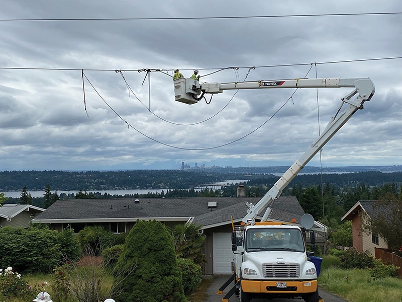 Wilson Construction crew members prepare to remove a sleeve out of the old conductor.
