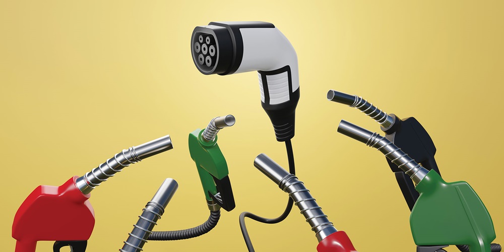 Gas nozzles surround and point at an EV charger against a yellow background. Image by Shutterstock / Dragon Claws.