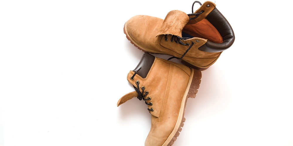 Tan work boots. Image by Shutterstock / Giamka.