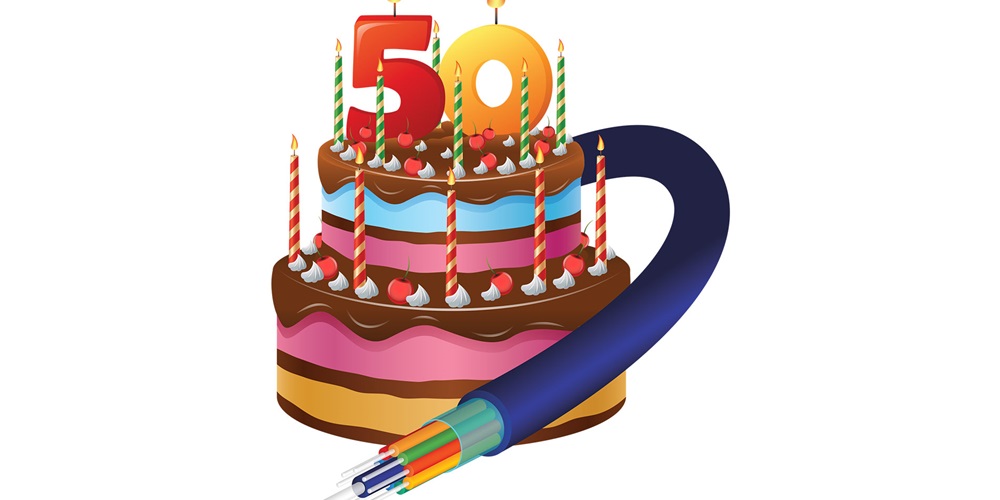 Illustration of a birthday cake with candles reading 50 and an electrical cord wrapped around it. Image by Shutterstock.