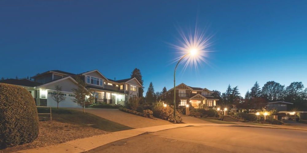 Cul-de-sac at night with lights. Image by Shutterstock / Romakoma.