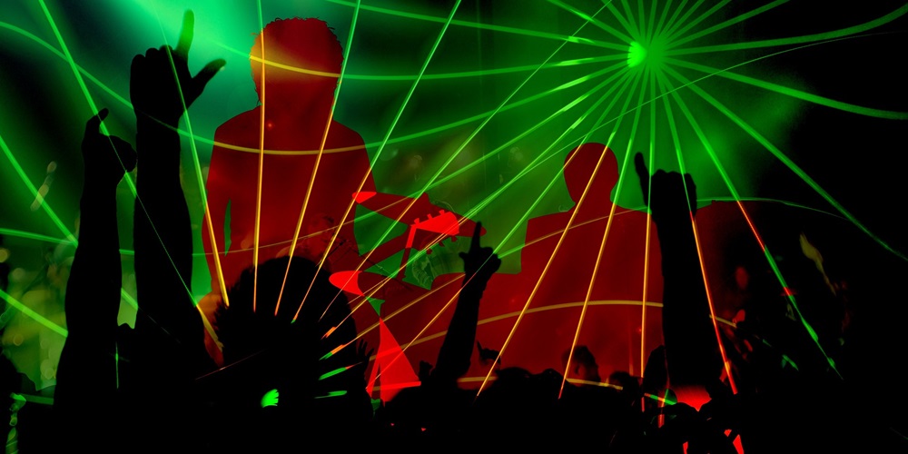 silhouette dancers with concert lights