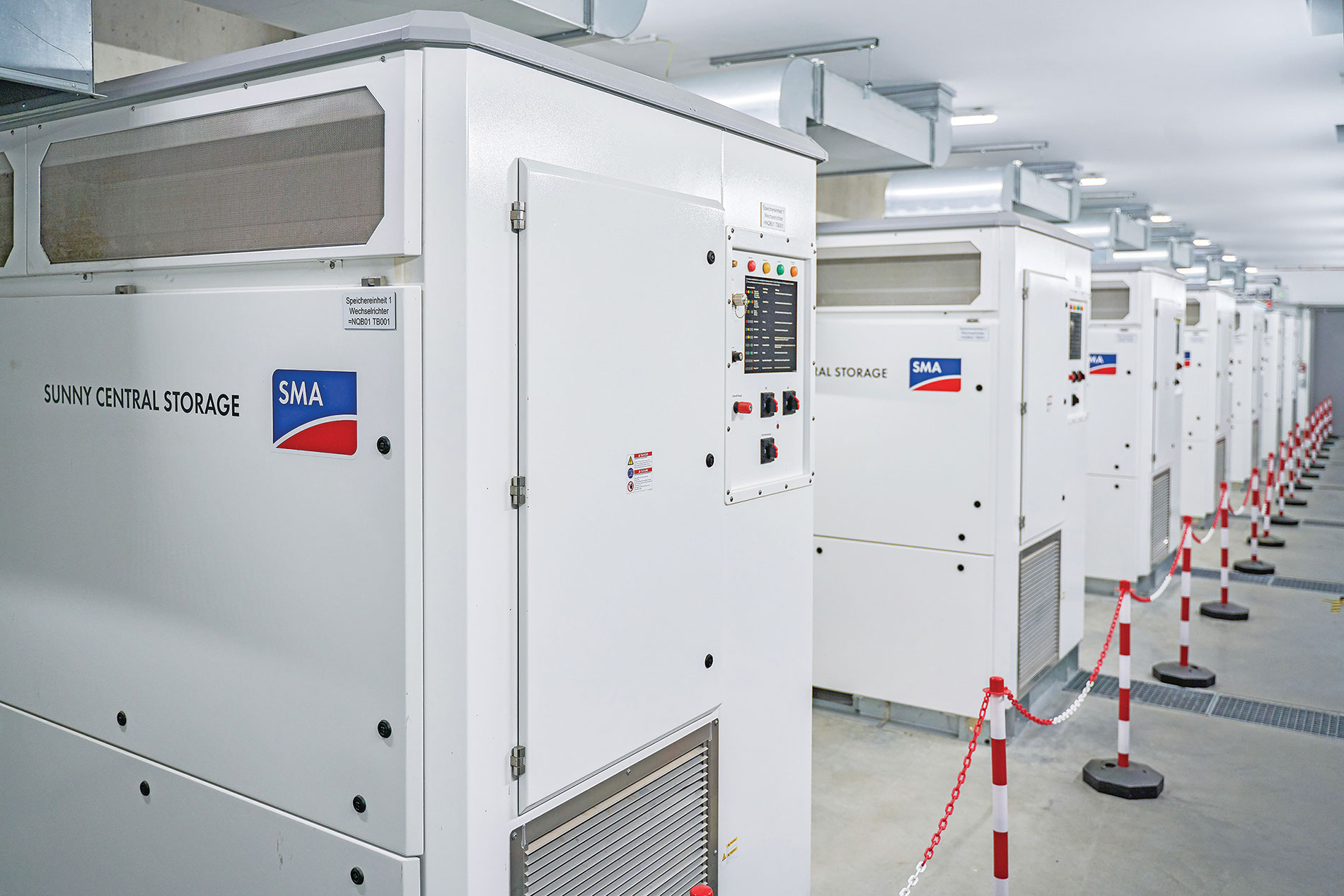 Row of white grid-forming inverters. Image by SMA America.