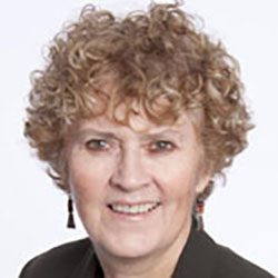 A woman, Susan Casey, smiles. Image by Susan Casey.