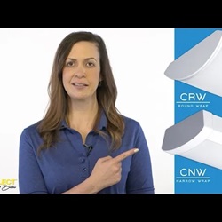 A woman in a blue shirt points at an image of 2 luminaires