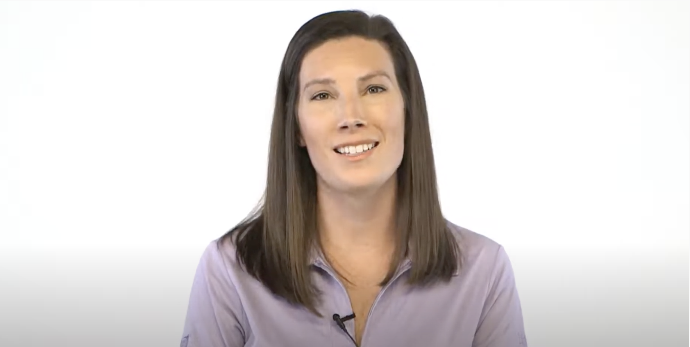 tradeselect thumbnail 3 A woman in a purple shirt with brown hair smiles at the camera