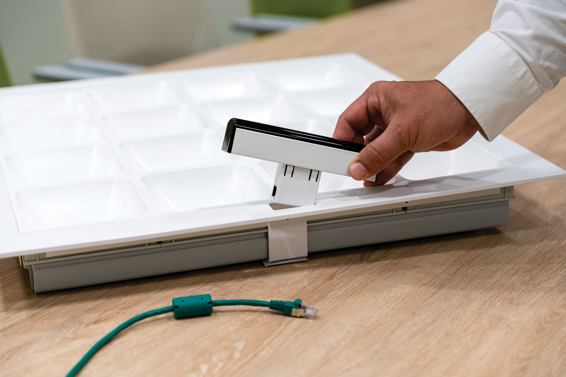 Signify’s TruLiFi product uses an LED fixture featuring a plug-in receiver to transmit a Li-Fi signal. Courtesy of Signify