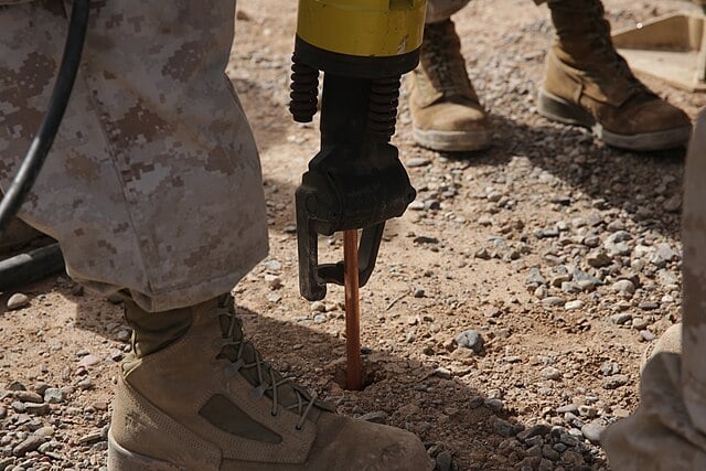 Grounding electrode rod installed in the earth. Credit: U.S. Marine Corps.