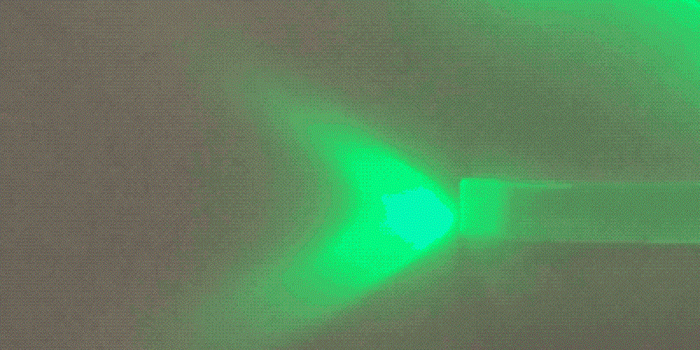 Green light against a dark background.