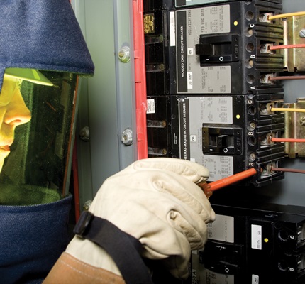 Electrician in an arc flash suit