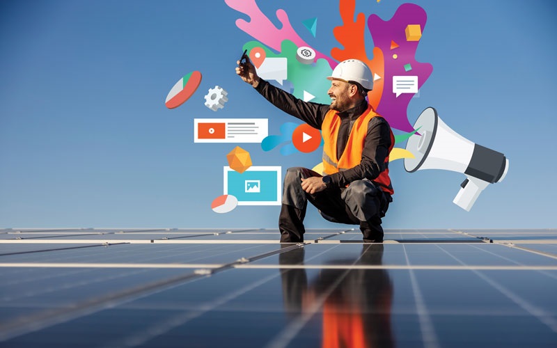 Electrician standing on solar panel roof taking a selfie with socal media illustrations behind him